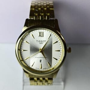 gold-tone Tissot Powermatic 80 with the two-tone dial and Roman numeral XII