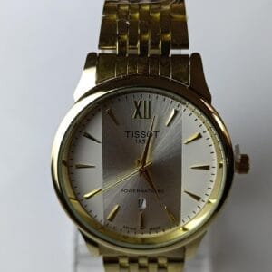 gold-tone Tissot Powermatic 80 with the two-tone dial and Roman numeral XII