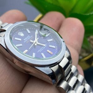 Sophisticated Edge: Silver Rolex with Blue Dial