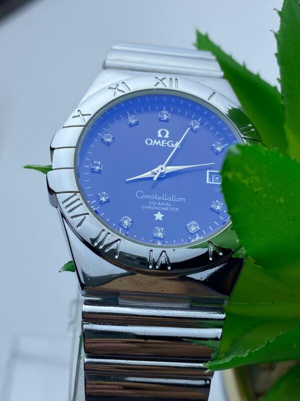 Silver-Toned Omega Watch with Roman Numerals and Diamond Markers